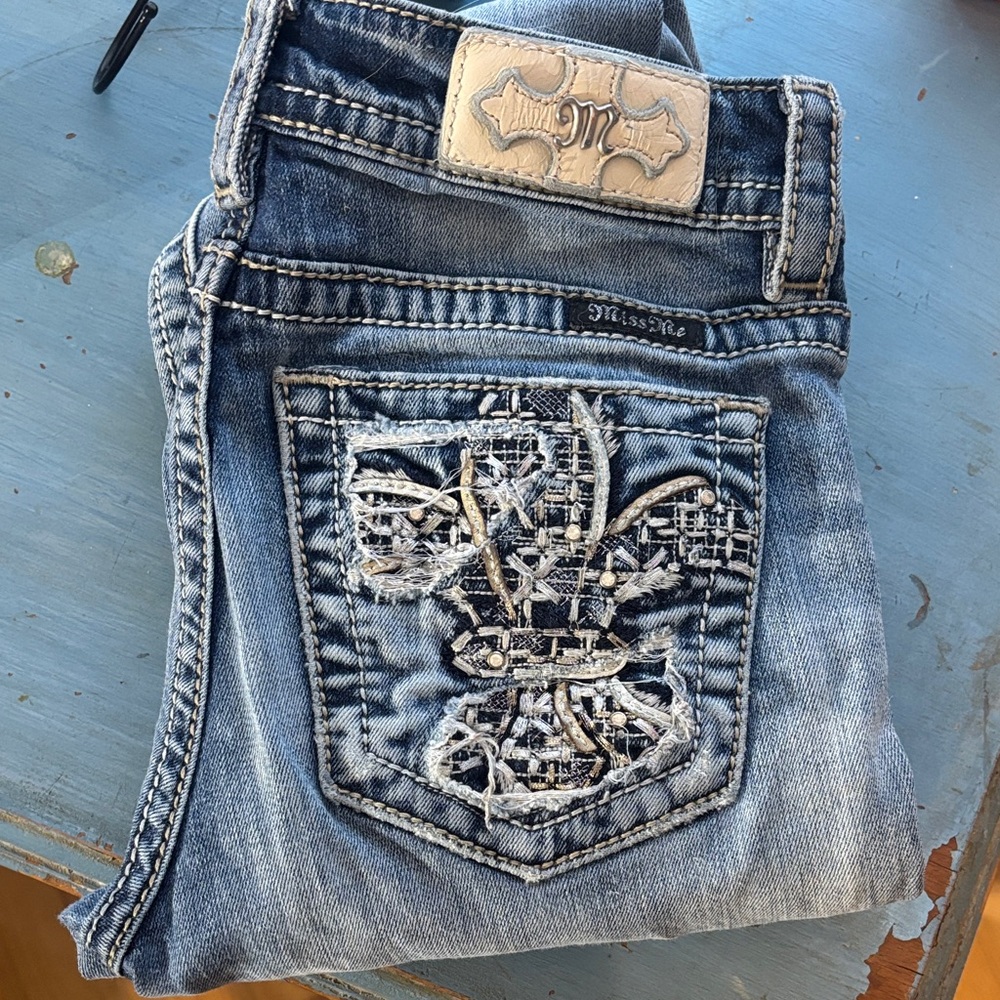 Miss Me Distressed Blue Jeans with Silver Embellishments